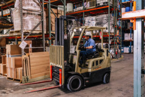 UDA employee driving forklift